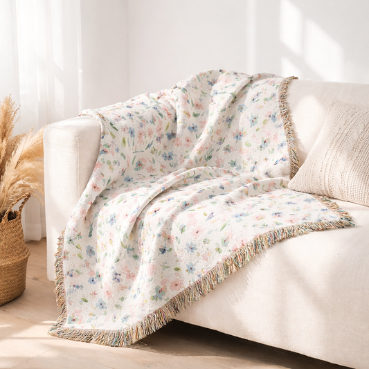 Soft Meadow luxury woven throw blanket styled on sofa – soft pastel cotton tapestry blanket for cozy minimalist interior design