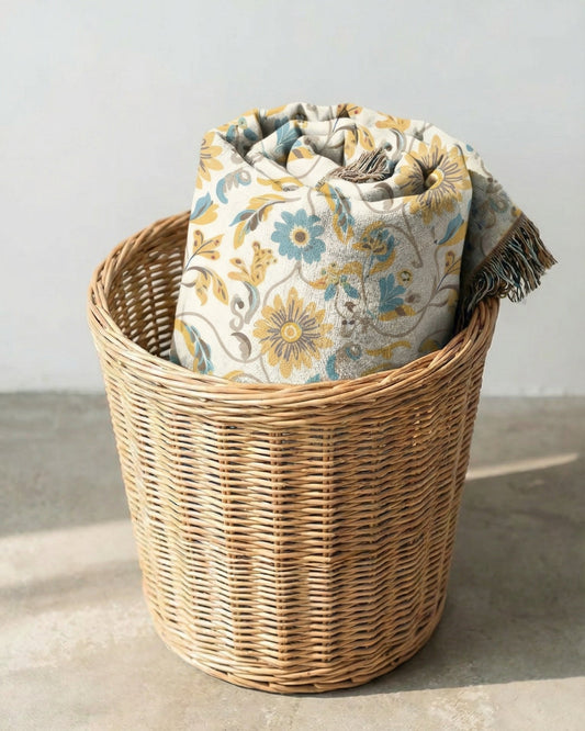 Golden Meadow cotton woven throw blanket styled in basket – warm golden floral tapestry blanket for cozy modern home interior